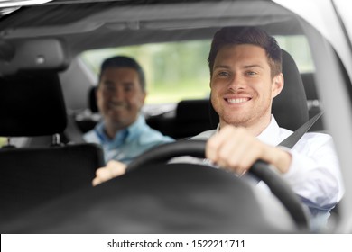 transport, people and taxi concept - happy smiling male driver driving car with passenger