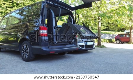 Transport for person with disability on wheelchair with van lift.