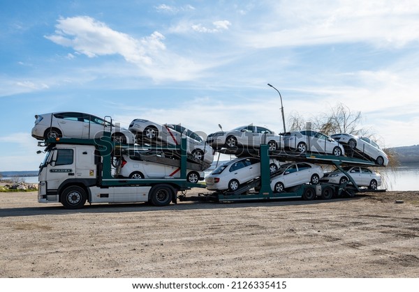 Transport and production of\
vehicles. Car transporter carries. Romania, Severin. February, 19,\
2022