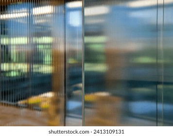 transport rack for glass plates. glazing of buildings with new tempered glass with stripes pattern. the crossbar distorts the light and creates abstract images with an indeterminate blur. - Powered by Shutterstock