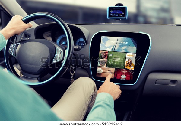 transport,\
road trip, car driving, technology and people concept - close up of\
male hand pointing to on-board computer\
menu