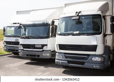 transport service company delivery and service van trucks front of factory warehouse distribution - Shutterstock ID 1342063412