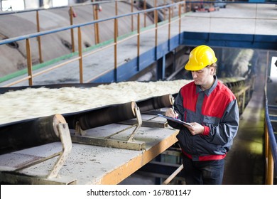 Transport Of Sugar On The Production Line, Worker Writes The Quality Information 