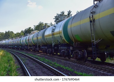 Transport tank car LNG by rail, gas - oil products. LPG transport propane. The fuel train, rolling stock with petrochemical tank cars. Liquefied natural gas export. Soft focus, possible granularity