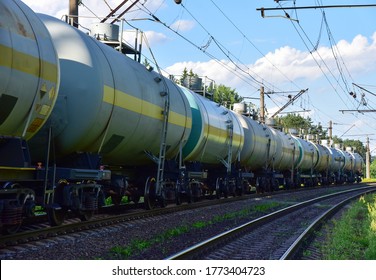 Transport Tank Car LNG By Rail, Gas - Oil Products. LPG Transport Propane. The Fuel Train, Rolling Stock With Petrochemical Tank Cars. Liquefied Natural Gas Export. Object In Motion, Out Of Focus