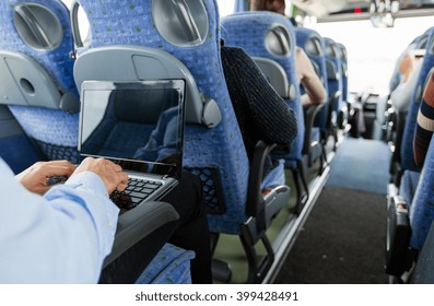 Transport, Tourism, Business Trip And People Concept - Close Up Of Man With Laptop Typing In Travel Bus