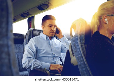 Transport, Tourism, Business Trip And People Concept - Man With Smartphone And Laptop Calling In Travel Bus