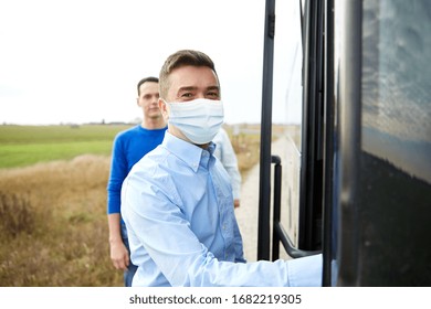 transport, tourism and pandemic concept - male passenger wearing protective medical mask for protection from virus boarding travel bus - Powered by Shutterstock - Get 15% off with code: PIKWIZARD15