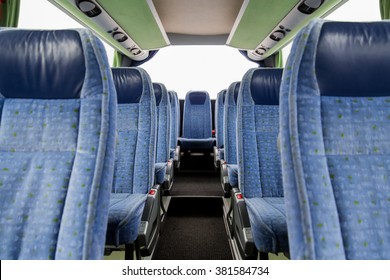 transport, tourism, road trip and equipment concept - travel bus interior and seats