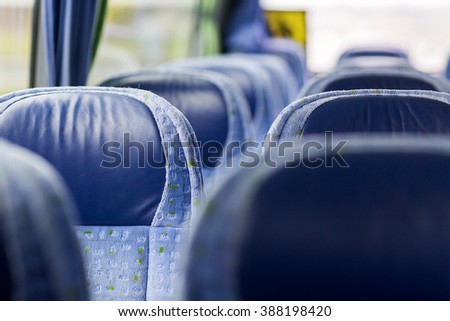 transport, tourism, road trip and equipment concept - travel bus interior and seats