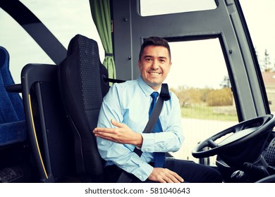 transport, tourism, road trip, gesture and people concept - happy driver inviting on board of intercity bus - Shutterstock ID 581040643