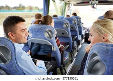 transport, tourism, road trip and people concept - group of happy passengers or tourists in travel bus - Shutterstock ID 377150551