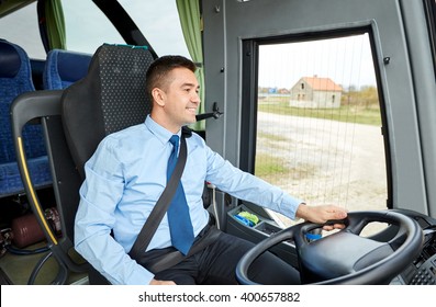 transport, tourism, road trip and people concept - happy driver talking to microphone and driving bus