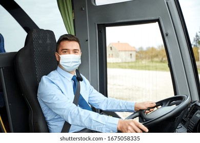transport, travel and pandemic concept - male driver wearing protective medical mask for protection from virus disease driving intercity bus