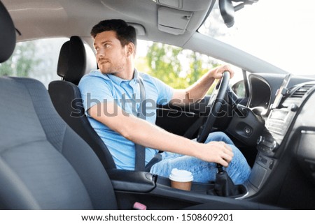 transport, vehicle and driving concept - man or car driver looking back