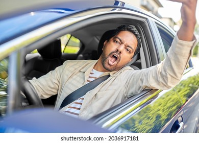 transport, vehicle and people concept - angry indian man or driver driving car and gesturing - Shutterstock ID 2036917181