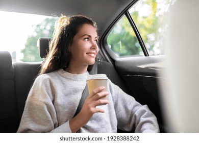 Transport, Vehicle And People Concept - Happy Smiling Woman Or Female Passenger Drinking Takeaway Coffee In Taxi Car