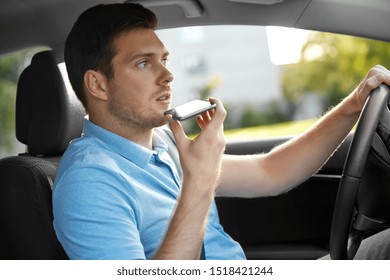 Transport, Vehicle And People Concept - Man Or Driver Driving Car And Recording Message Using Voice Command Recorder On Smartphone