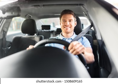 Transport, Vehicle And People Concept - Smiling Man Or Driver Driving Car