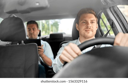 transport, vehicle and taxi concept - male driver driving car with passenger
