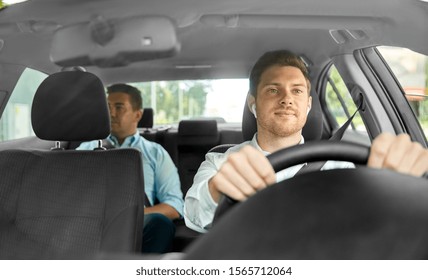 Transport, Vehicle And Taxi Concept - Male Driver With Wireless Earphones Or Hands Free Device Driving Car With Passenger