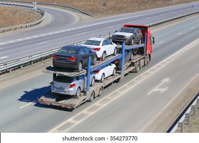 transportation of car on semi-trailer on country highway