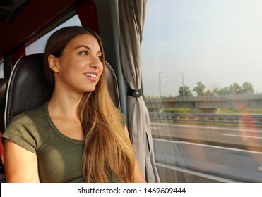 Transportation concept. Young traveler woman on bus or train looking through the window. - Powered by Shutterstock