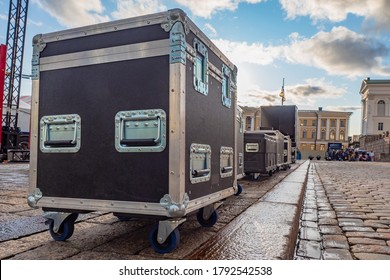 Transportation of concert equipment. Containers with wheels and handles on the Palace square of St. Petersburg. Transportation of equipment for performing artists. Preparation for the concert.