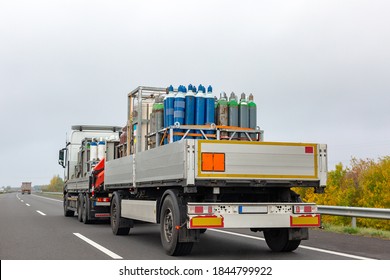 Transportation of cylinders with oxygen for patients with coronavirus. Truck delivering gas cylinders for medical purposes 
