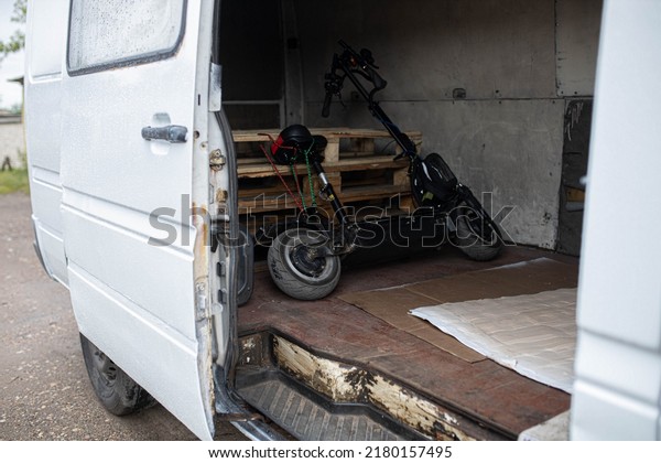 transportation of\
electric scooters in a van\
truck.