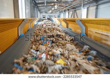  Transportation of fuel obtained from waste (RDF) on a belt to the boiler for combustion. Fuel conveyor. Processing of municipal solid waste into an energy source.  