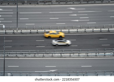 Transportation Highway Background. Aerial Top View. Two Taxi Cars Drive On The Road In Motion Blur