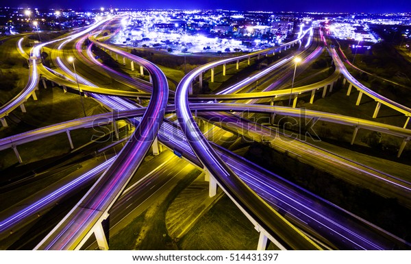 transportation\
highway system in America. time lapse , long exposure , urban\
sprawl interstate and interchange loops and turnarounds on highway\
183 and Mopac expressway in Austin\
Texas