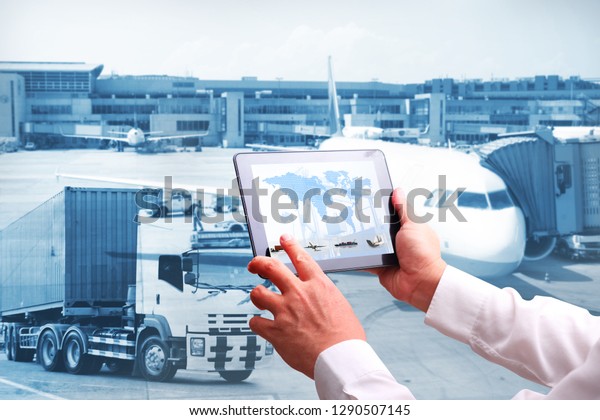 Transportation import export concept,Man hand holding\
cell phone or tablet  automate wireless for control drlivery\
shipment 
