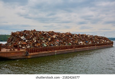 Transportation industry. Ship barge transports scrap metal and sand with gravel - Shutterstock ID 2182426577