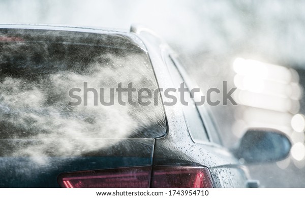 Transportation Industry. Spring Time\
Pressure Car Washing Close Up. Powerful Car Cleaning\
Concept.