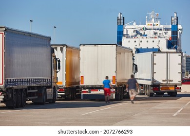 Transportation and logistic industry. Trucks and vessel ready to be loaded - Shutterstock ID 2072766293