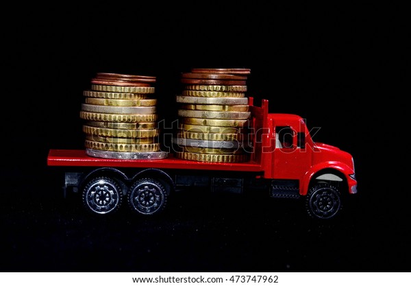 Transportation of Money for the Red Toy Truck\
Business Concept