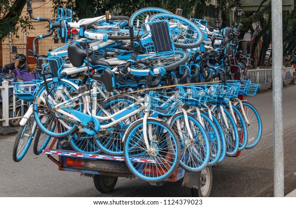 Transportation of new bicycles on a micro\
truck on the street of the Chinese city of\
Guilin.