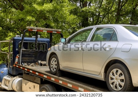 Transportation of non working automobile on tow truck by to car service