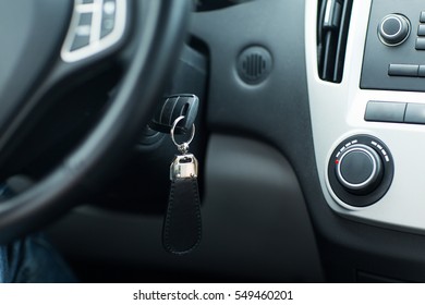 Transportation And Ownership Concept - Car Key In Ignition Start Lock