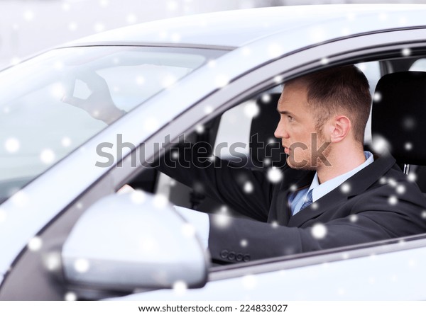 transportation, people and vehicle concept - close up\
of businessman driving\
car