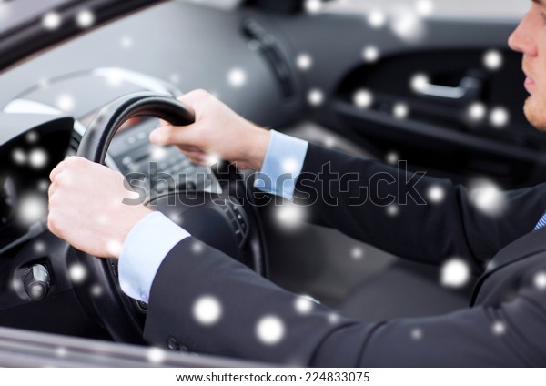 transportation, people and vehicle concept - close up\
of businessman driving\
car
