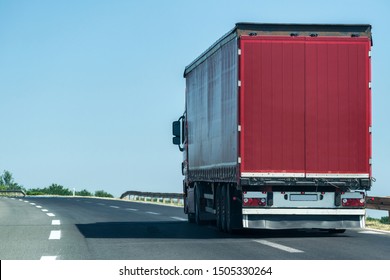 Transportation Truck on summer country highway under blue sky