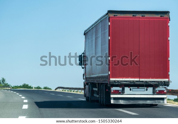 Transportation Truck on summer country highway under
blue sky