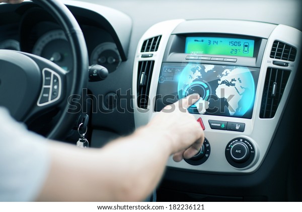 transportation and vehicle concept - man using car
control panel