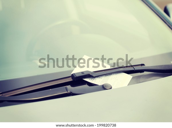transportation and vehicle concept - parking
ticket on car
windscreen
