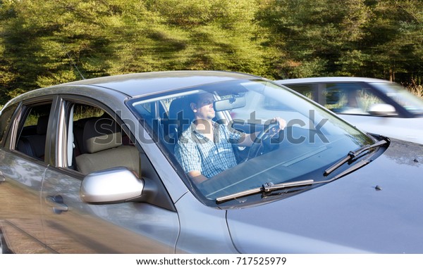 transportation and vehicle concept - serious man on
road trip in their car

