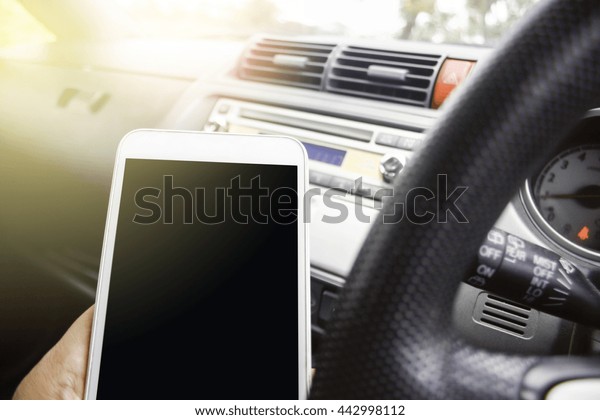 transportation and vehicle concept -using phone\
while driving the car with burst\
light