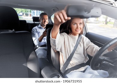 Transportation, Vehicle And People Concept - Happy Smiling Female Driver Driving Car With Male Passenger